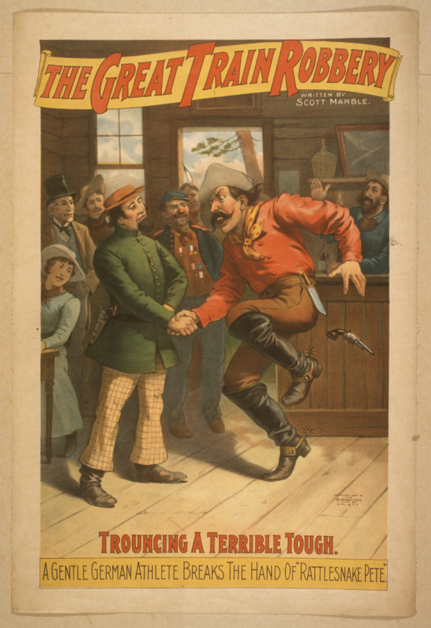 Eine Gruppe von Menschen, die drinnen stehen, einer hält eine Waffe, mit Text oben und unten 'The Great Train Robbery - Trouching a Terrible Tough'.