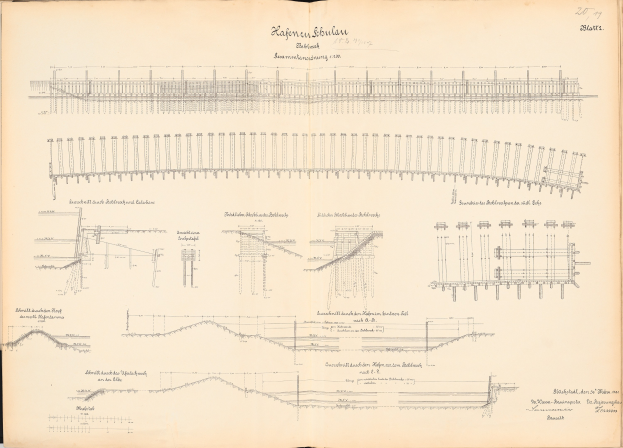 Offenes Buch mit detaillierten Zeichnungen und Texten eines Eisenbahnsystems, einschließlich einer Illustration einer Eisenbahnschiene.