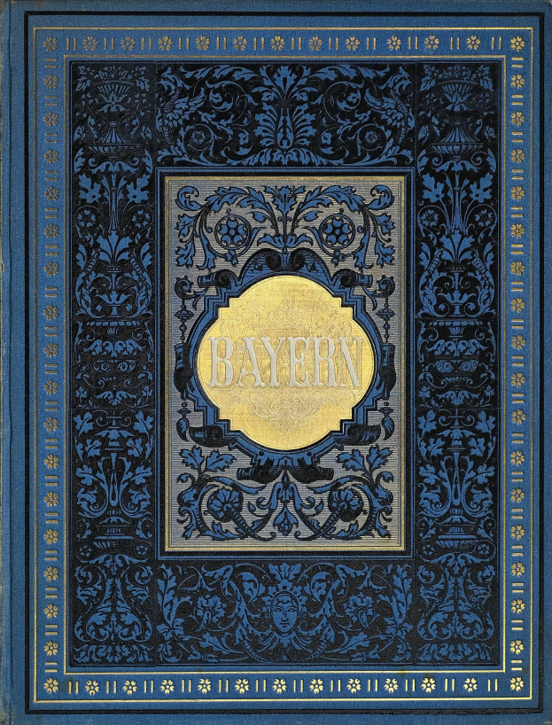 Ein blau-goldenes Buch mit dem Wort "Bayern" darauf, verziert mit detailreichen Ornamenten.