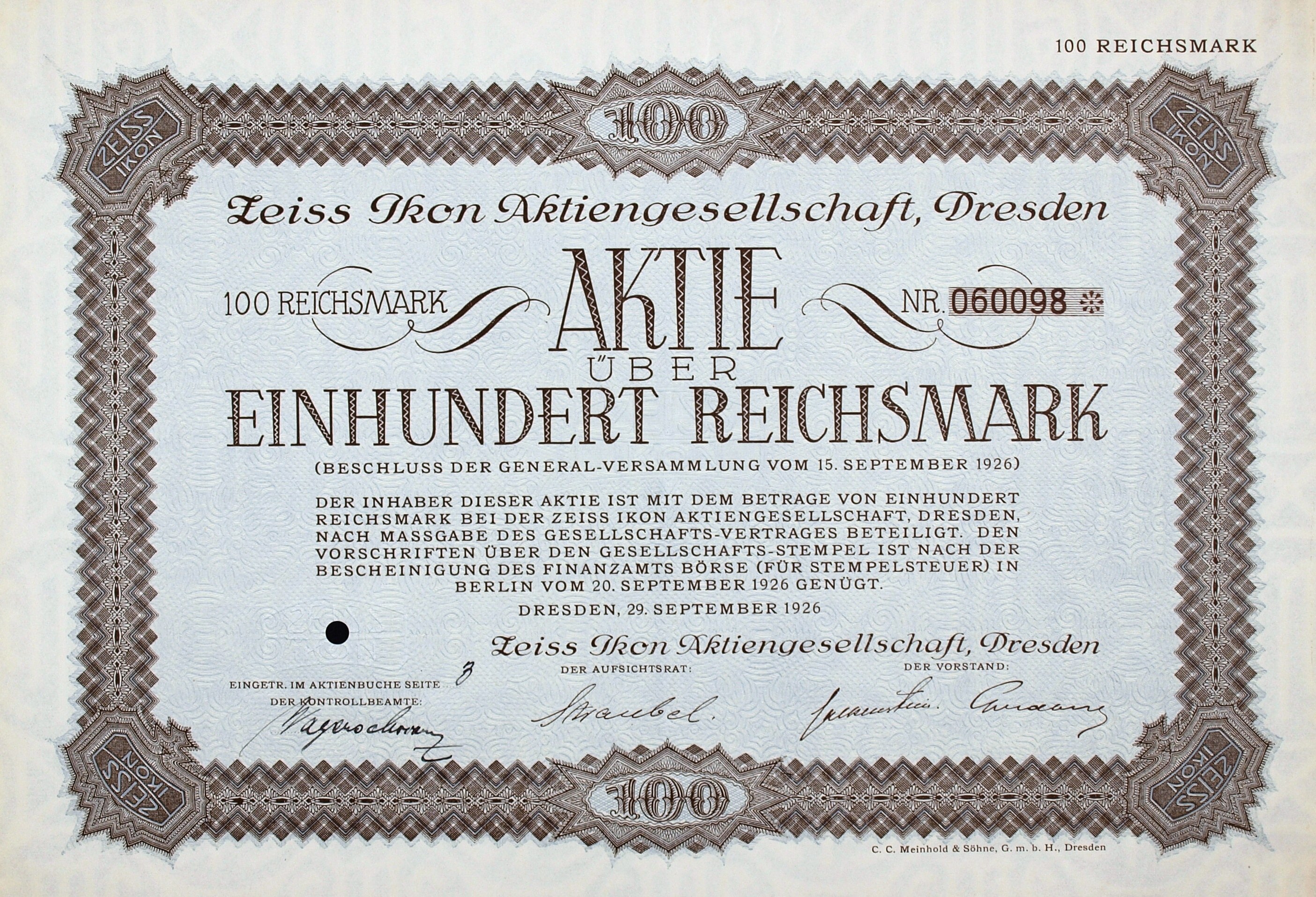 Alter deutscher Aktienchein für 100 Reichsmark mit schwarzem Rand und deutscher Text.